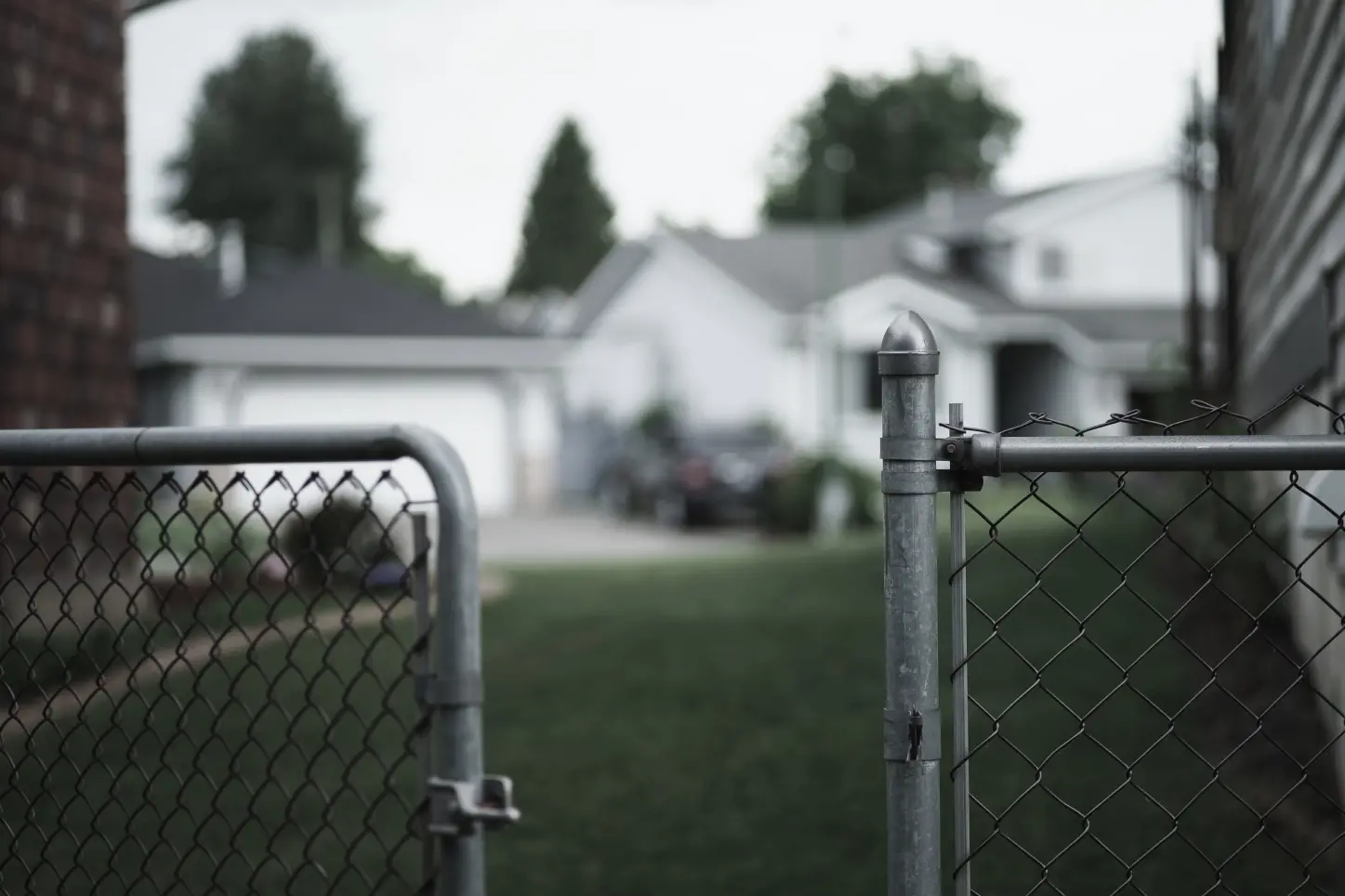 fence with house in background